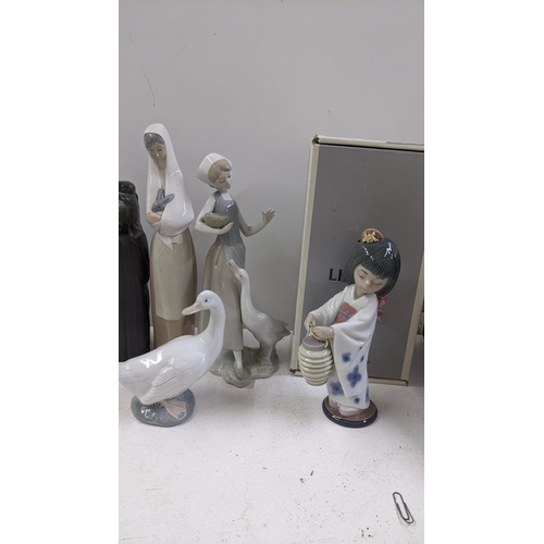 139 - Two Lladro Gress porcelain figures of Chinese men, a boxed Lladro 'Oriental Lantern' figure and othe... 