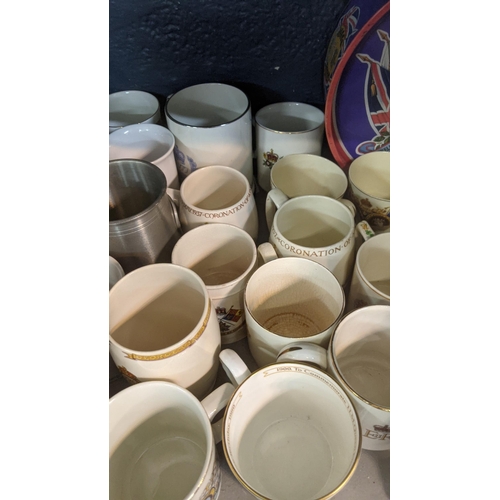 177 - Commemorative ceramics to include mainly mugs, tankards, tins and a figure Location:3.3
 If there is... 