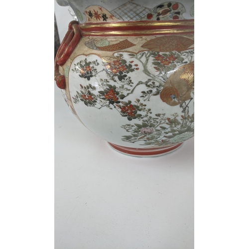 180 - A Japanese Kutani Meiji period jardinière with a wavy rim, decorated with bird panels
Location:1.1

... 