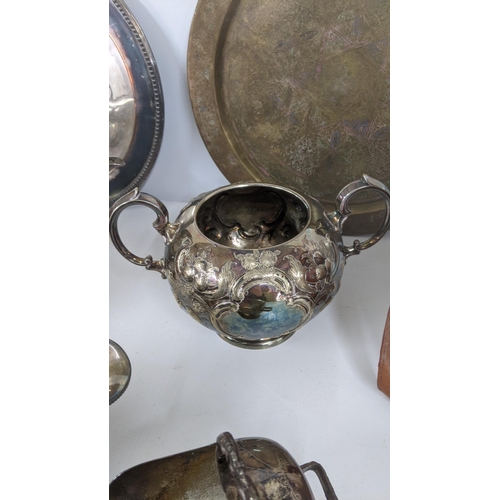 186 - A mixed lot of metalware to include mostly silver plated items to include a three piece tea set with... 