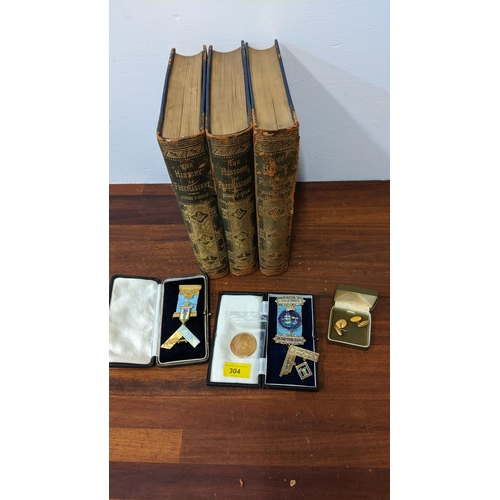 304 - Masonic regalia to include silver gilt and enamelled medallions, gilt cufflinks and books
Location:L... 