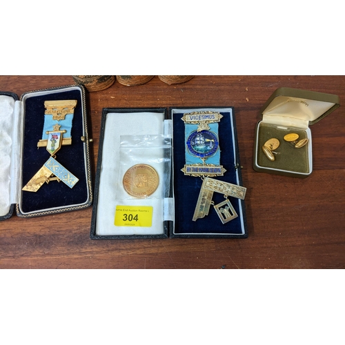 304 - Masonic regalia to include silver gilt and enamelled medallions, gilt cufflinks and books
Location:L... 