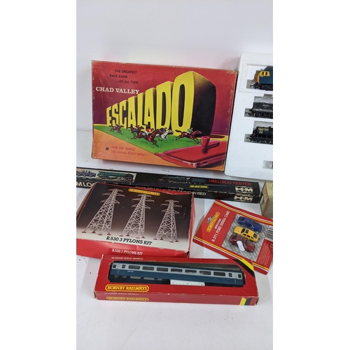 329 - Mixed boxed toys to include Chad Valley Escalado, Millholme model unbuilt train various Hornby 00 ga... 