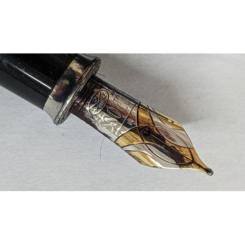 330 - A cross fountain pen with an engine turned case and an 18ct white and yellow gold nib
Location:CAB

... 