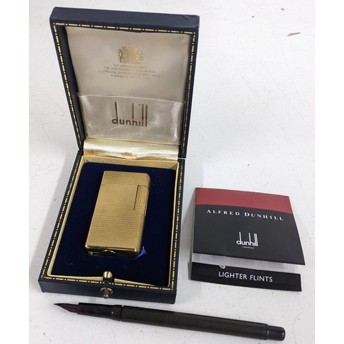 331 - A Dunhill 70 gold plated lighter with flints and fitted box, together with a fountain pen
Location:C... 