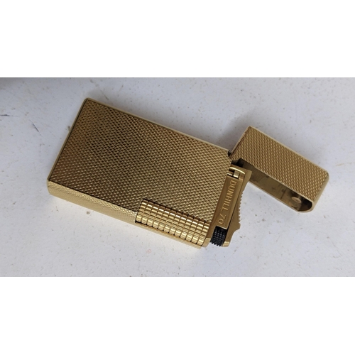 331 - A Dunhill 70 gold plated lighter with flints and fitted box, together with a fountain pen
Location:C... 