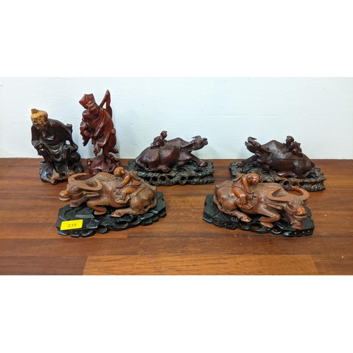 335 - Early 20th century Chinese carved wooden model animals to include water buffalo on stands
Location:G... 