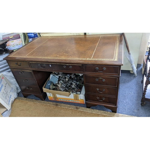 350 - A reproduction mahogany twin pedestal desk having a leather topped scriber and nine drawers, 75cm h ... 