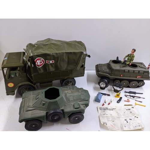 67 - Three military toy vehicles to include a Sharna Toys Leyland Truck with cover, an Irwin military veh... 