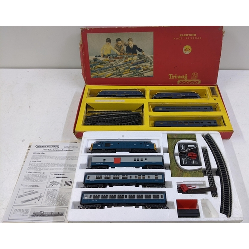 84 - Two 00 gauge model railway sets to include a Triang electric model railway with original box and pac... 