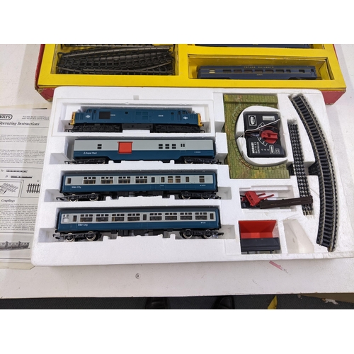 84 - Two 00 gauge model railway sets to include a Triang electric model railway with original box and pac... 