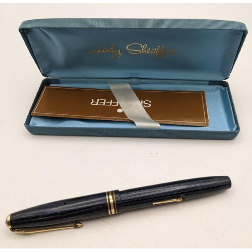 115 - A Conway Stewart no 77 fountain pen with 14ct gold nib in a lady Sheaffer case 
Location: CAB2