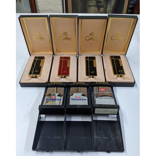 118 - Four boxed Colibri lighters, three in black, one in red, and three boxed Zippo lighters with Virgin ... 