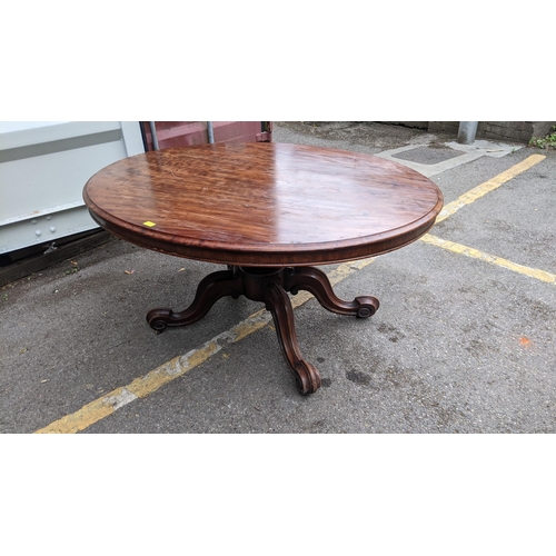 217 - A Victorian solid walnut breakfast table with a tip top, on splayed legs, 71cm h x 145cm w
Location:... 