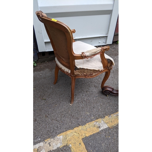 219 - A 19th century satinwood open arm chair with carved ornament, on cabriole legs
Location: G

If there... 