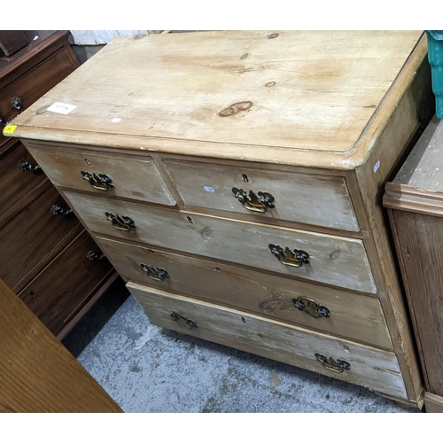 264 - A 19th century pine chest of two short and three long drawers on turned feet Location:G
If there is ... 