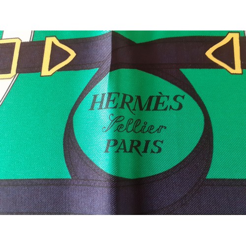 6 - Hermes- A 1980's green and navy silk 'Eperon d'Or' scarf designed by H. d'Origny with gold coloured ... 