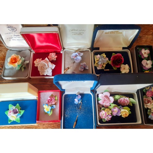 140 - A collection of china posy jewellery to include Coalport brooches, Royal Worcester brooches, Aynsley... 