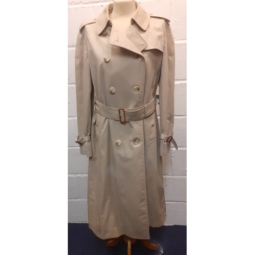 14 - Burberry-A 1970's beige double breasted 'Kensington' lightweight cotton trench coat having brown lea... 