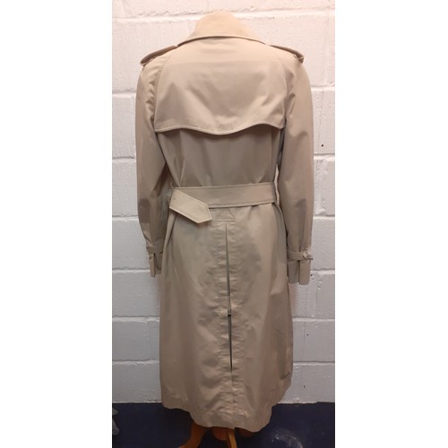 14 - Burberry-A 1970's beige double breasted 'Kensington' lightweight cotton trench coat having brown lea... 