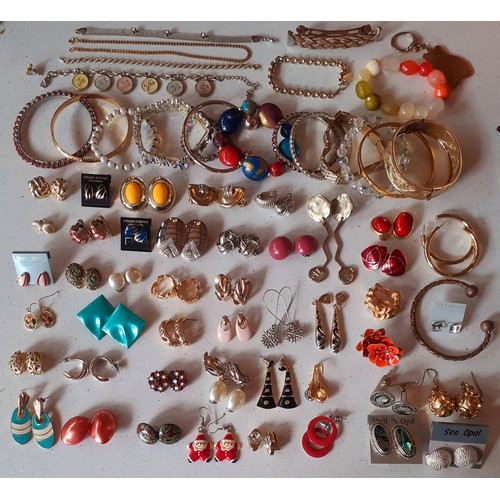 135 - A large quantity of modern costume jewellery comprising earrings, bracelets to include a Rochelle 18... 