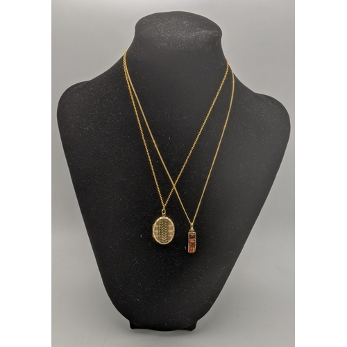 34 - A gold front and back locket pendant on a gold necklace, tested as 9ct gold, together with a 9ct gol... 