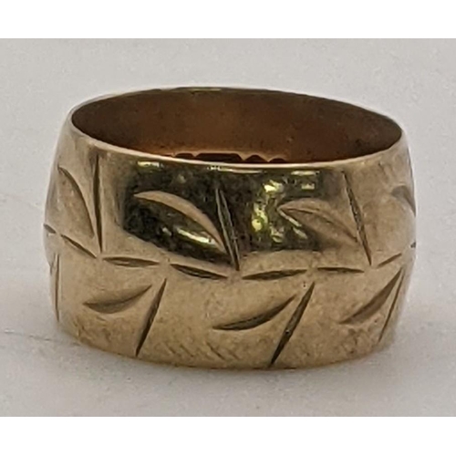 42 - A 9ct gold thick gauge band having an engraved pattern, size J, 4.5g
Location:RING
If there is no co... 