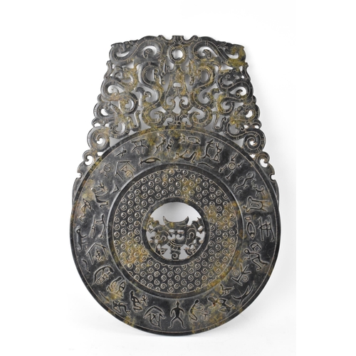 132 - A Chinese nephrite jade BI disk, relief carved with ancient script, repeated motif, pierced roundel ... 