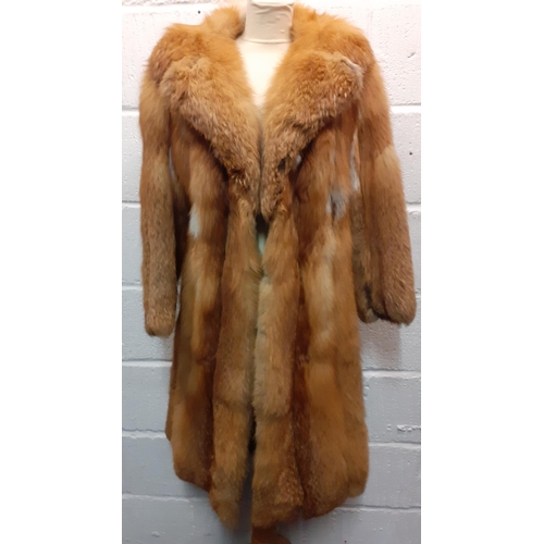 72 - A group of fur coats to include a late 1970's/early 1980's red fox calf length coat A/F with shawl c... 