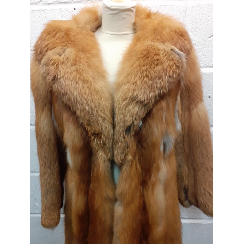 72 - A group of fur coats to include a late 1970's/early 1980's red fox calf length coat A/F with shawl c... 