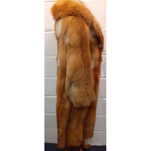 72 - A group of fur coats to include a late 1970's/early 1980's red fox calf length coat A/F with shawl c... 