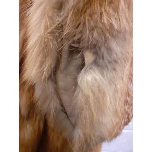 72 - A group of fur coats to include a late 1970's/early 1980's red fox calf length coat A/F with shawl c... 