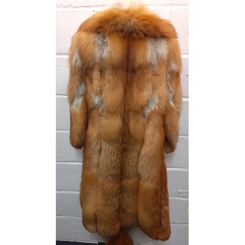 72 - A group of fur coats to include a late 1970's/early 1980's red fox calf length coat A/F with shawl c... 