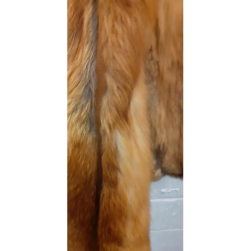 72 - A group of fur coats to include a late 1970's/early 1980's red fox calf length coat A/F with shawl c... 