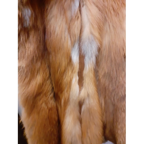 72 - A group of fur coats to include a late 1970's/early 1980's red fox calf length coat A/F with shawl c... 