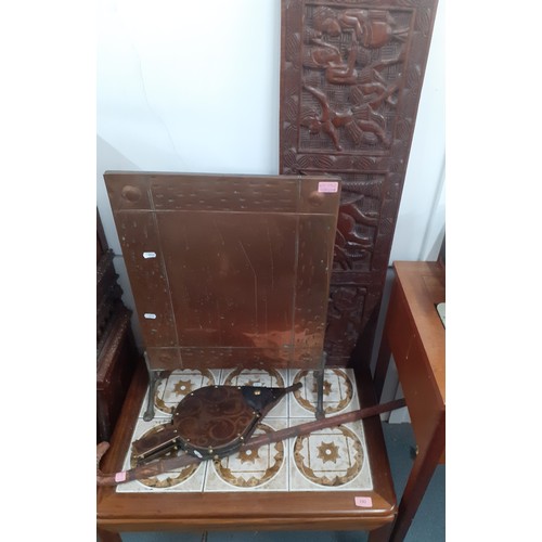 192 - A 1970's tile top coffee table, a copper fire screen, a carved panel, a walking stick, an electric S... 