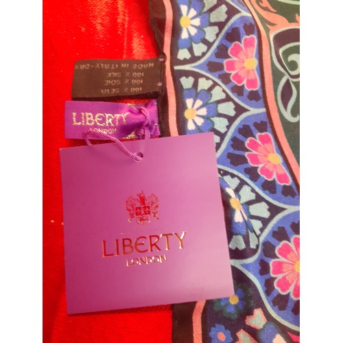 8 - Liberty-A silk wrap, unworn with original tags, in pinks, blues and green with hand rolled black bor... 