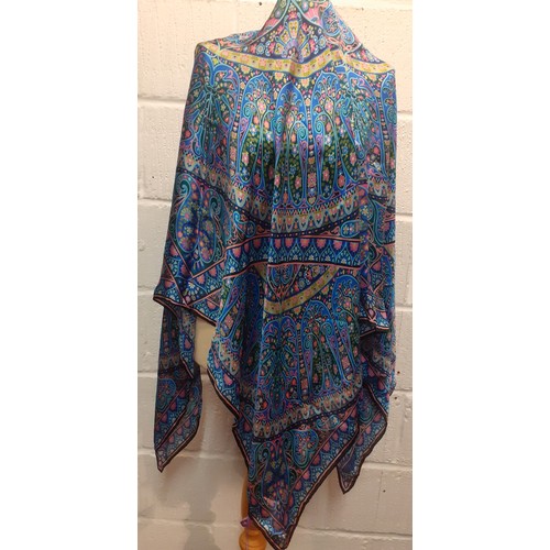 8 - Liberty-A silk wrap, unworn with original tags, in pinks, blues and green with hand rolled black bor... 