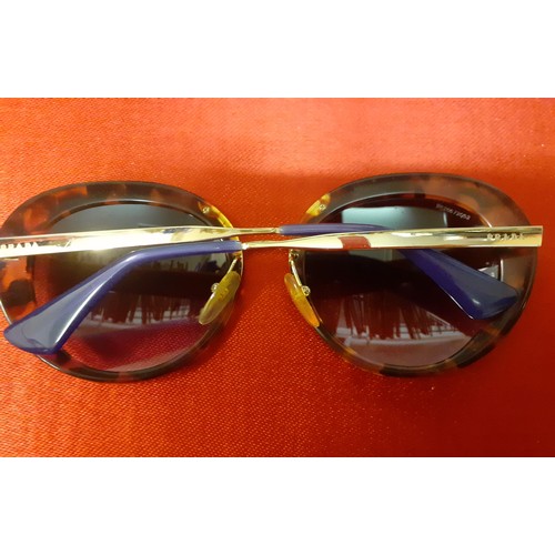 15 - Prada-A pair of vintage over-sized sunglasses with mock tortoiseshell frame, gold tone and purple te... 