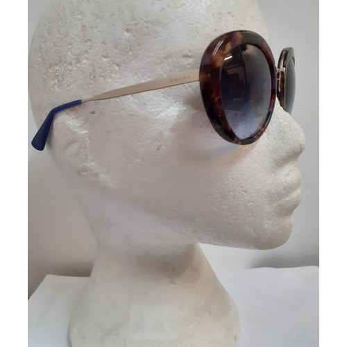 15 - Prada-A pair of vintage over-sized sunglasses with mock tortoiseshell frame, gold tone and purple te... 