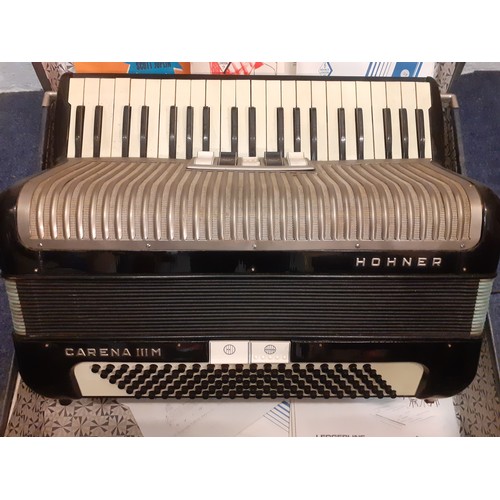 179 - A Hohner Carena IIIM accordion with sheet music in travel case together with a vintage projector. Lo... 