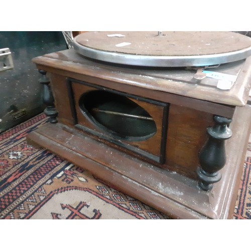 183 - An HMV gramophone on oak base A/F requiring restoration with brass horn together with 4 record cases... 