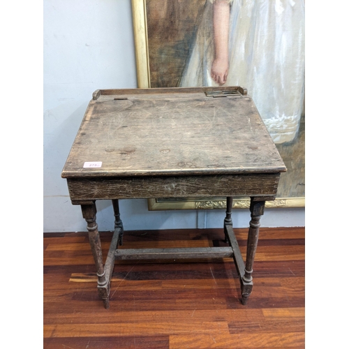 141 - A mixed lot to include an early/mid 20th century child's desk with a hinged top, raised on tapered l... 