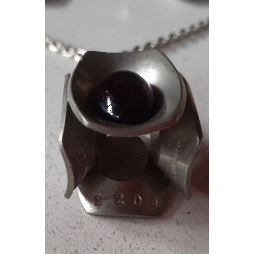 16 - Jorgen Jenson- A 1960's Danish modernist pewter jewellery suite comprising a pendant stamped with th... 