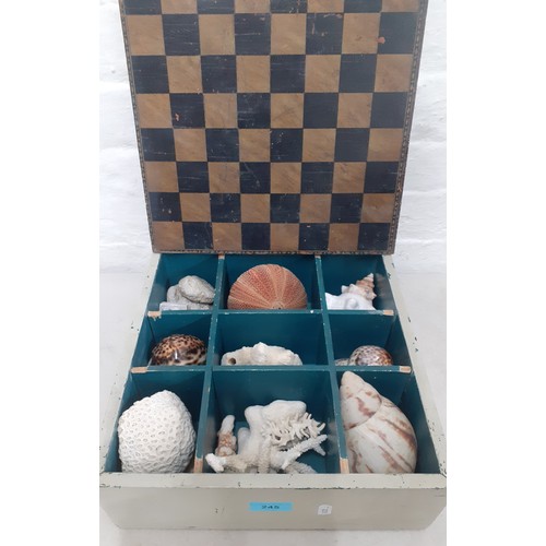A collection of shells and coral to include an urchin shell housed in a vintage chess box with chequered lid. Location:1.3
