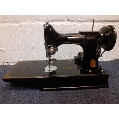 17 - A 1949 Singer 221K electric sewing machine serial no: EF560890 with accessories and black case, spoo... 