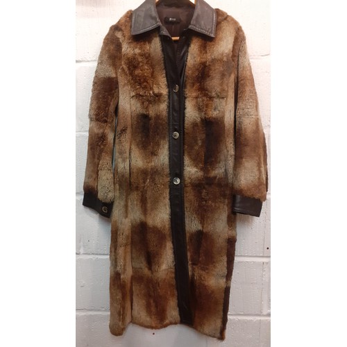 18 - Hugo Boss- A 1980's Press Sample of a brown beaver fur coat with brown leather trim, approx 36