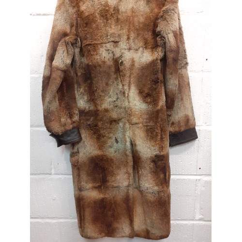 18 - Hugo Boss- A 1980's Press Sample of a brown beaver fur coat with brown leather trim, approx 36