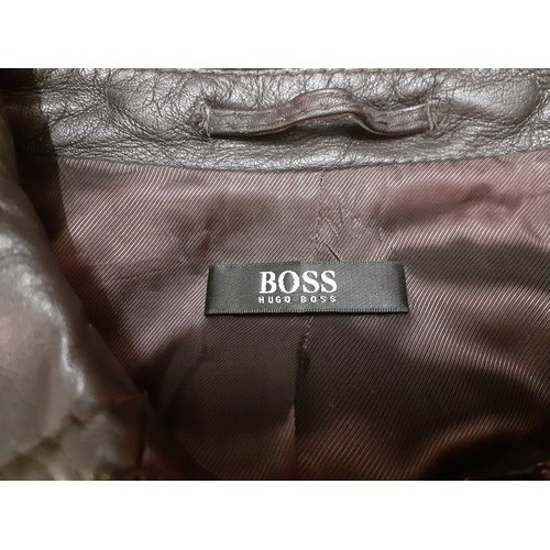 18 - Hugo Boss- A 1980's Press Sample of a brown beaver fur coat with brown leather trim, approx 36