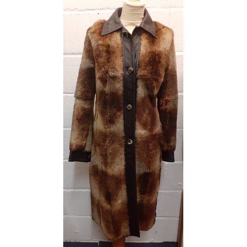 18 - Hugo Boss- A 1980's Press Sample of a brown beaver fur coat with brown leather trim, approx 36